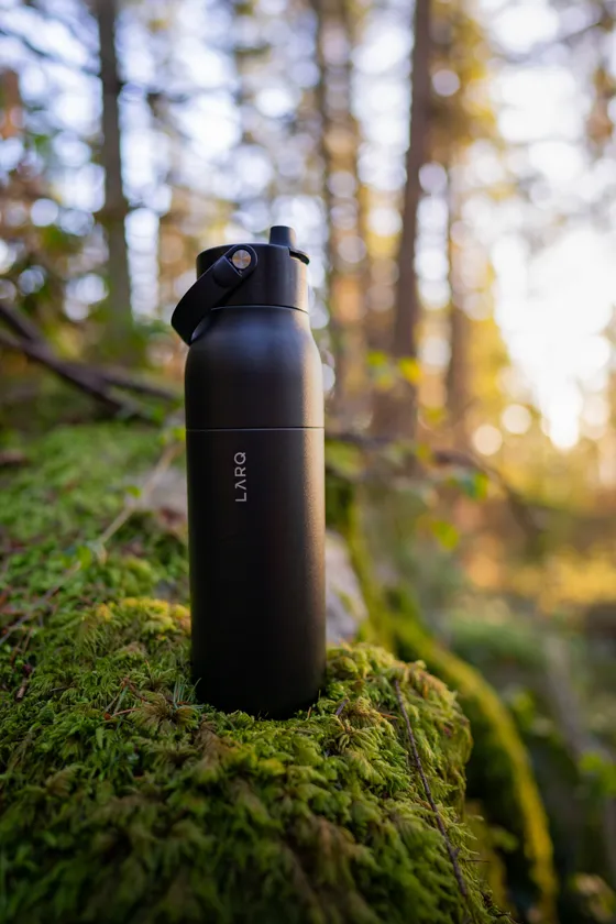 LARQ bottle on moss, forest floor product shot