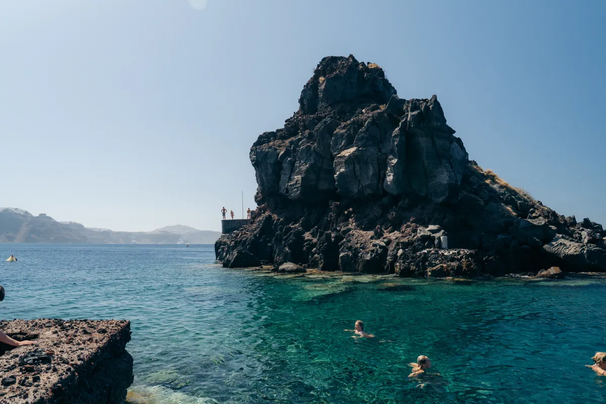 Cliff jumping Ammoudi Bay Santorini